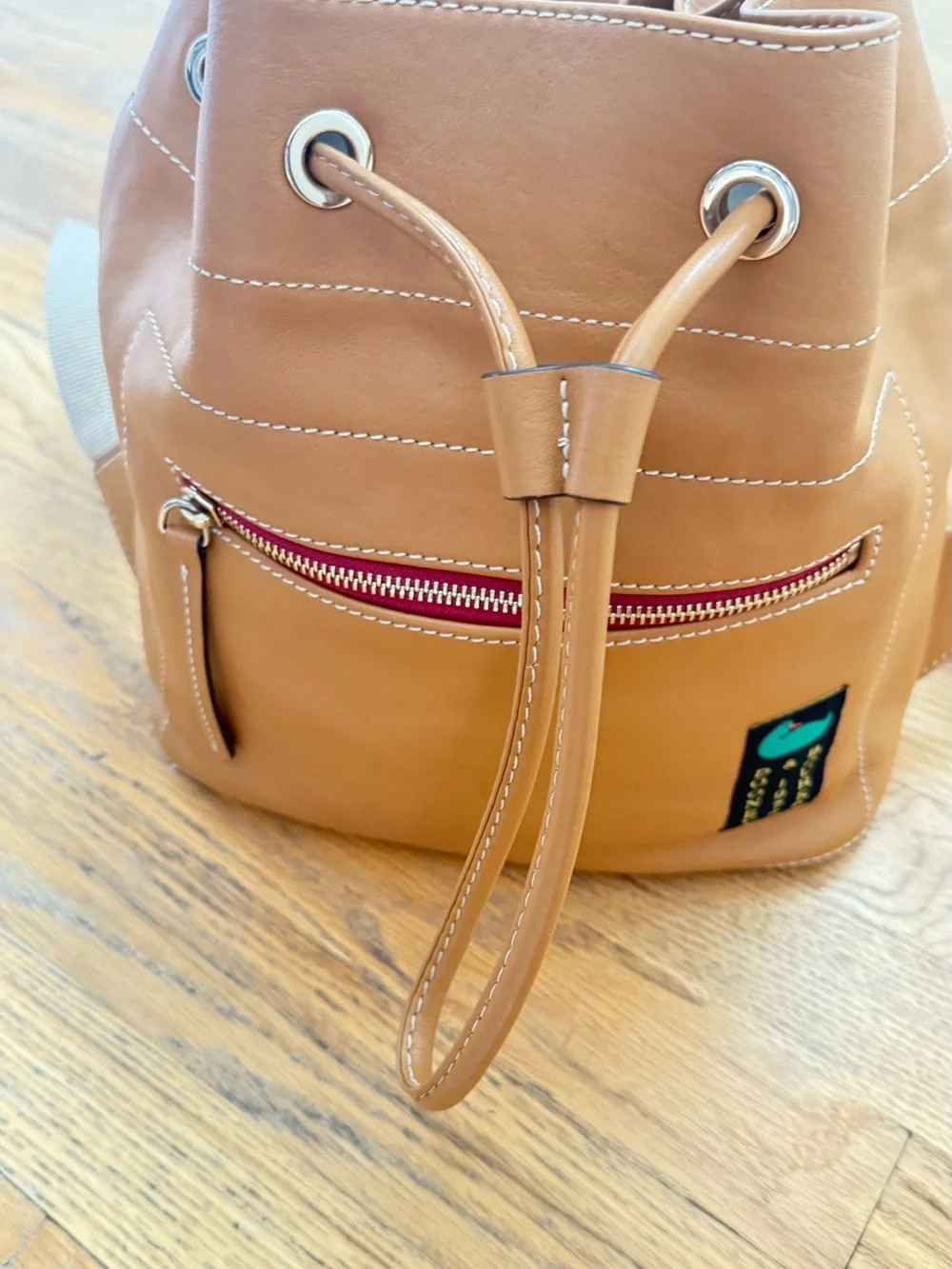 Dooney & Bourke Leather Backpack Duck Logo Tan Drawstring
